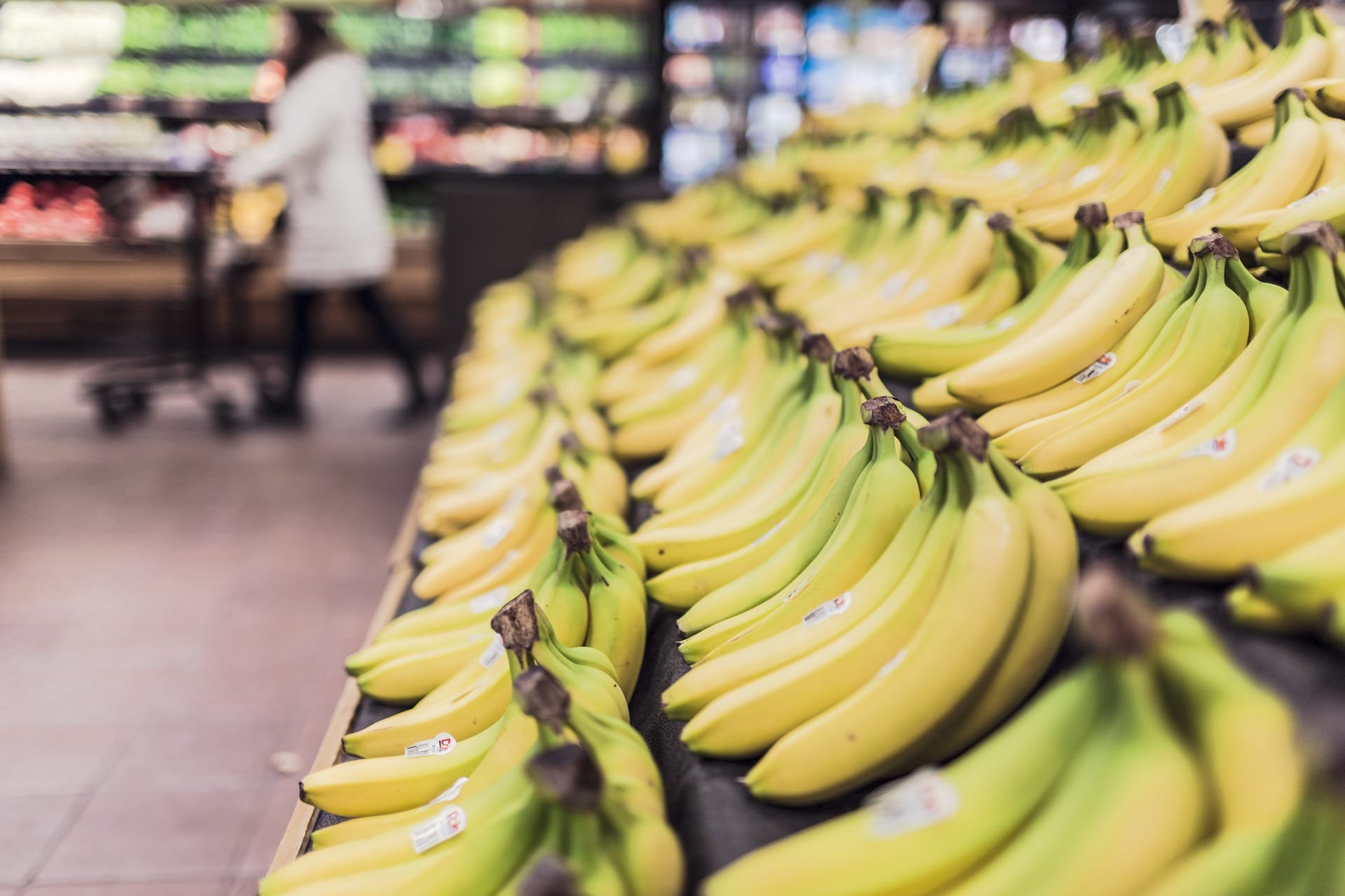 A display of fresh bananas at a supermarket.